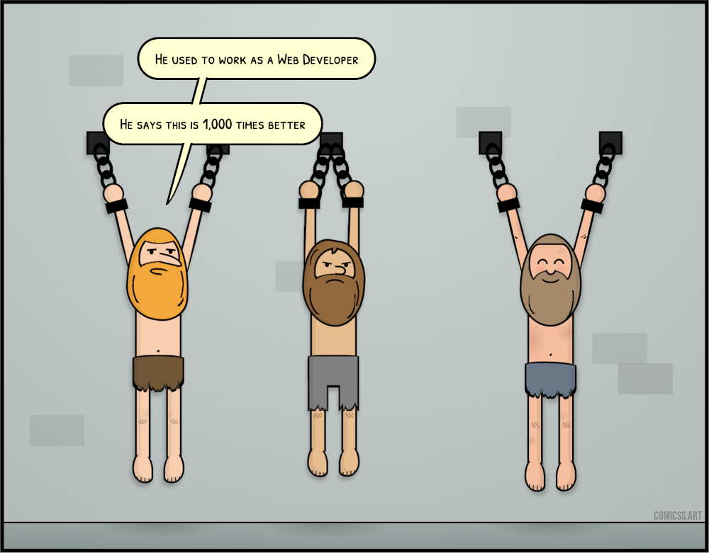 cartoon with three men hang chained in a dungeon. Two look sad, one looks happy. One of the sad ones says 'he used to be a web developer. he says this is 1,000 times better'